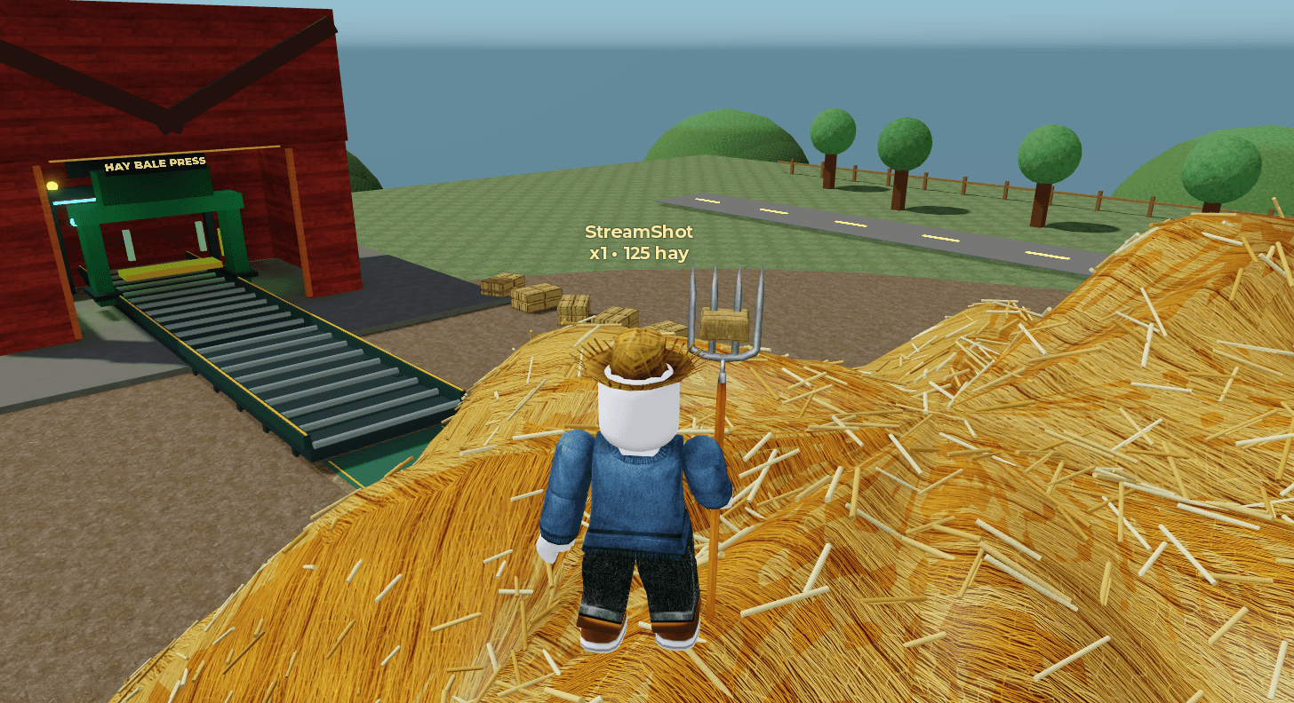 Roblox player standing on a haystack beside the hay bale press and conveyor