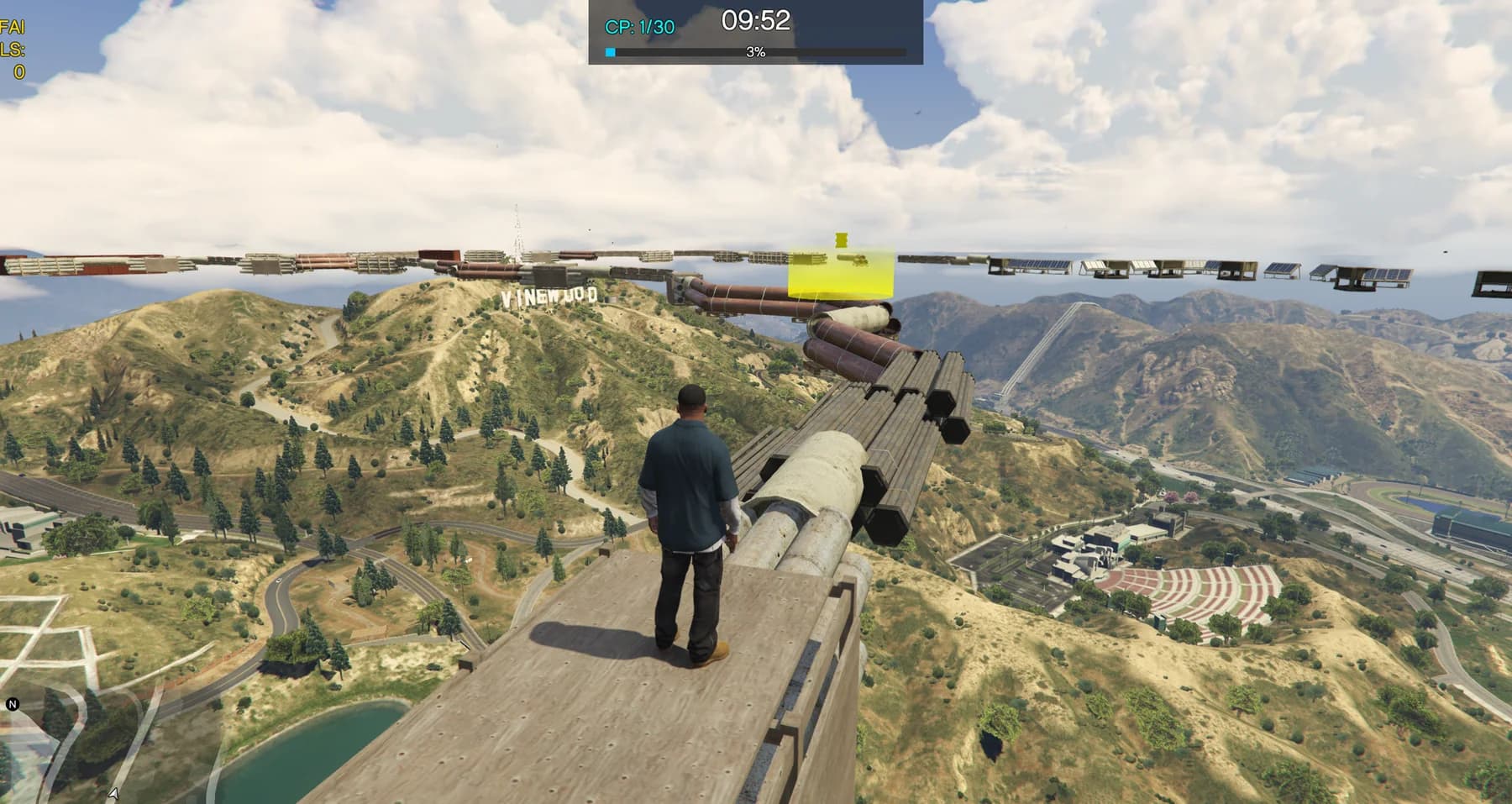 GTA V: Legacy Hiking gameplay: a player on an elevated checkpoint course above Vinewood.